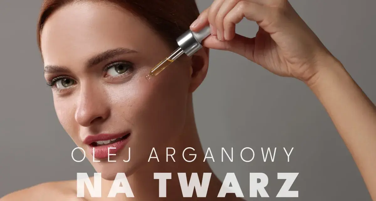 Kobieta aplikuje kroplę olejku arganowego na twarz. Delikatna pielęgnacja dla promiennej cery.