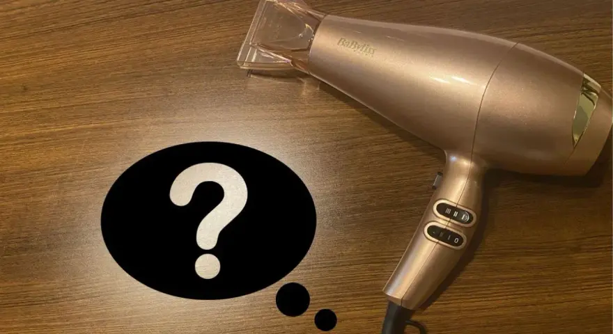 Złota suszarka BaByliss i znak zapytania. Czy suszarka niszczy włosy?